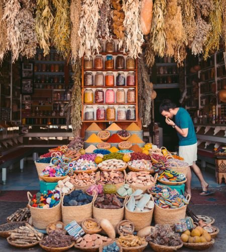 About Vibrant display of spices and goods in a Marrakesh street market showcasing Moroccan culture.